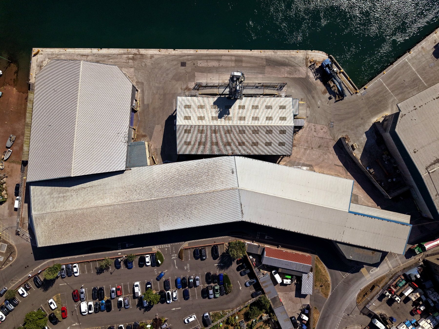 Real drone top-down view of commercial roofs, operational yards and access constraints