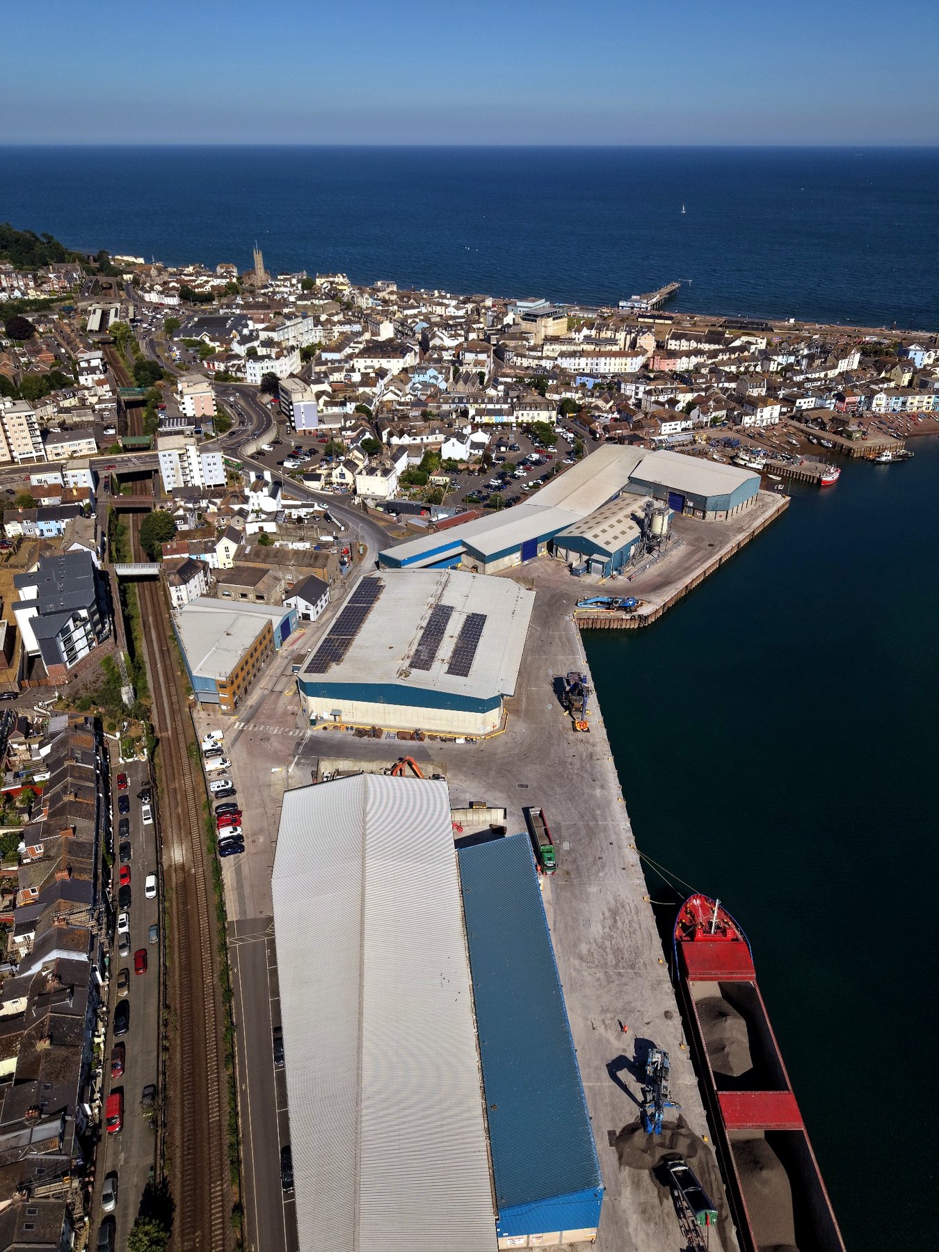 Real drone view across Teignmouth, commercial waterside property and the South Devon coast